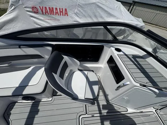 Slide: The Image of 2025 Yamaha Boats 195 S interior with sleek seating and modern dashboard design. - 9