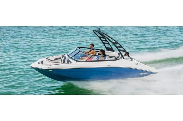 Slide: The Image of 2024 Yamaha Boats 195S speeding on water, featuring sleek design and vibrant blue hull. - 4