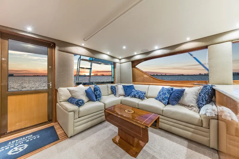 Slide: The Image of Luxurious interior of 1999 Hatteras 60 Convertible yacht with ocean view at sunset. - 25