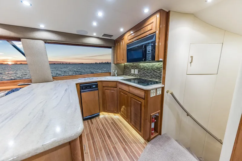 Slide: The Image of Interior of 1999 Hatteras 60 Convertible yacht with modern kitchen and ocean view. - 30