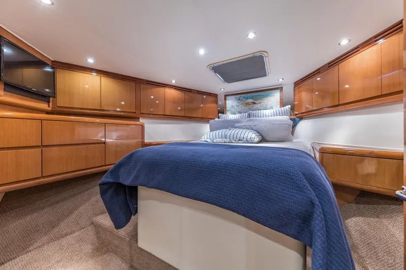 Slide: The Image of Luxurious cabin interior of 1999 Hatteras 60 Convertible yacht with elegant wood finishes. - 35
