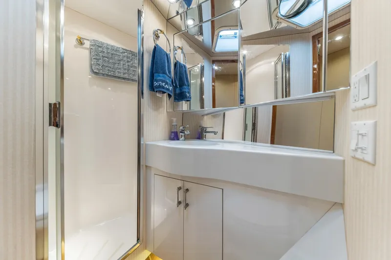 Slide: The Image of Luxurious bathroom in 1999 Hatteras 60 Convertible yacht with modern fixtures. - 39