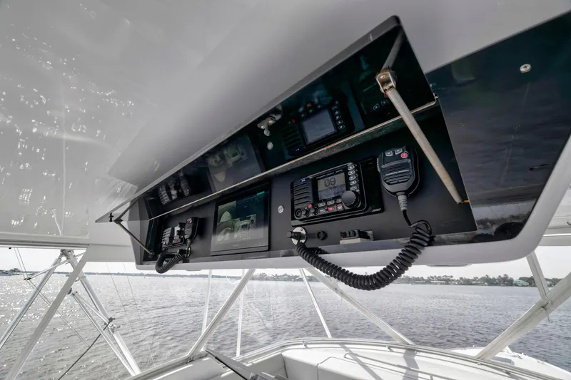 Slide: The Image of Control panel of 1999 Hatteras 60 Convertible yacht with navigation equipment. - 44