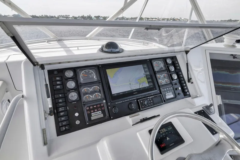 Slide: The Image of Cockpit dashboard of 1999 Hatteras 60 Convertible yacht with navigation instruments. - 46