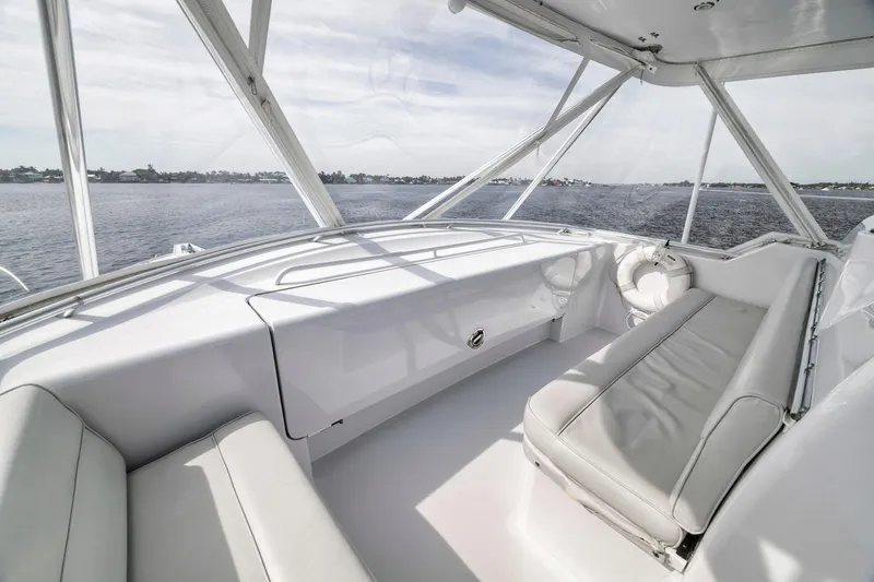 Slide: The Image of 1999 Hatteras 60 Convertible yacht interior with sleek seating and ocean view. - 49
