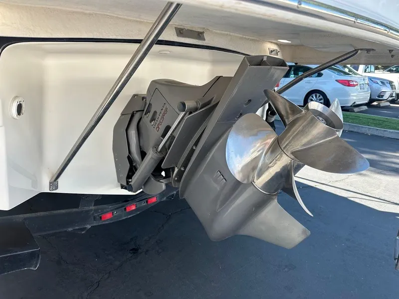 Slide: The Image of Propeller of 2006 Regal 2450 Cuddy boat, parked in a lot. - 11