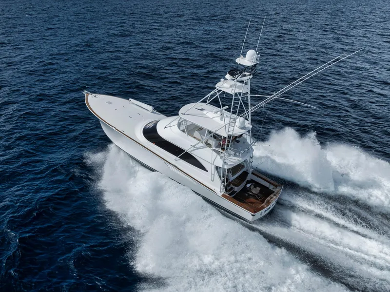 The Image of 2015 Viking 70 Convertible yacht cruising on open ocean waters. - 1