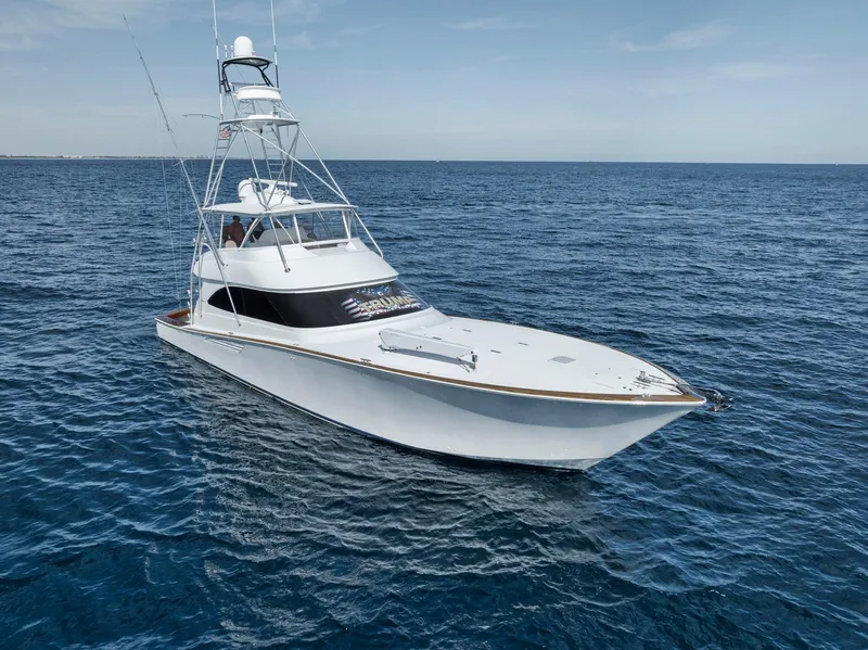Slide: The Image of 2015 Viking 70 Convertible yacht cruising on open sea. - 15