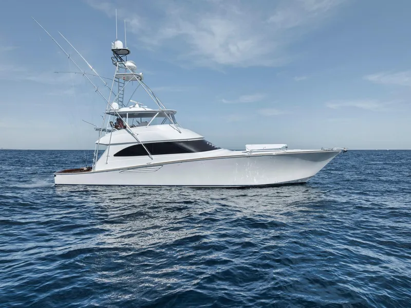 Slide: The Image of Viking 70 Convertible 2015 yacht cruising on open sea under clear sky. - 16