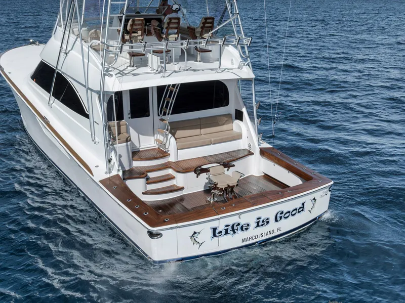 Slide: The Image of Viking 70 Convertible 2015 yacht on ocean, "Life is Good" on stern, Marco Island, FL. - 18