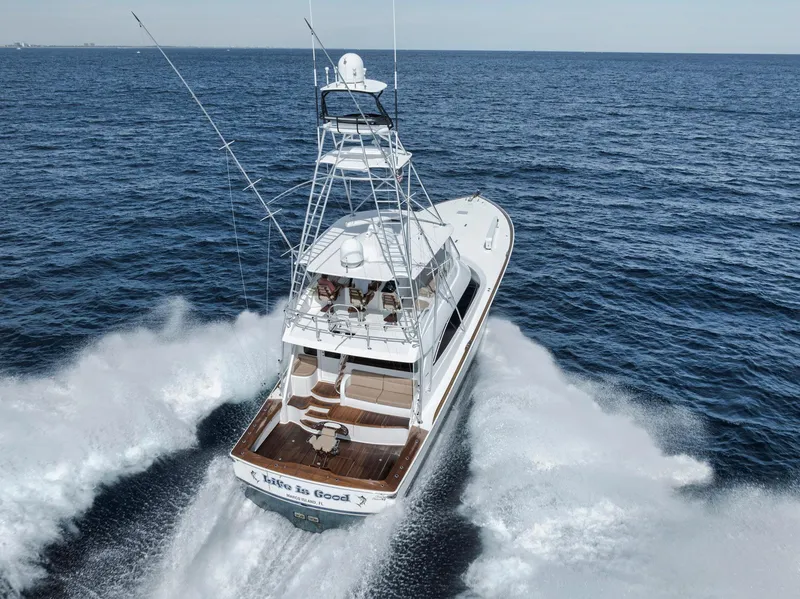 Slide: The Image of 2015 Viking 70 Convertible yacht cruising on open sea, aerial view. - 2