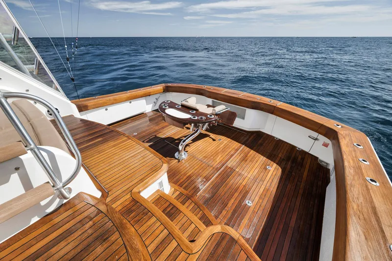 Slide: The Image of Luxurious 2015 Viking 70 Convertible yacht deck with wooden finish, overlooking the ocean. - 20