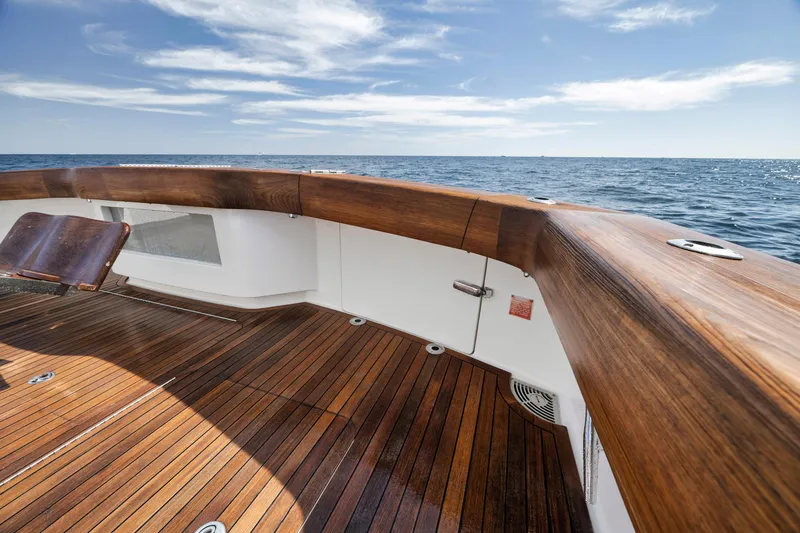 Slide: The Image of Viking 70 Convertible 2015 yacht deck with ocean view and wooden finish. - 22
