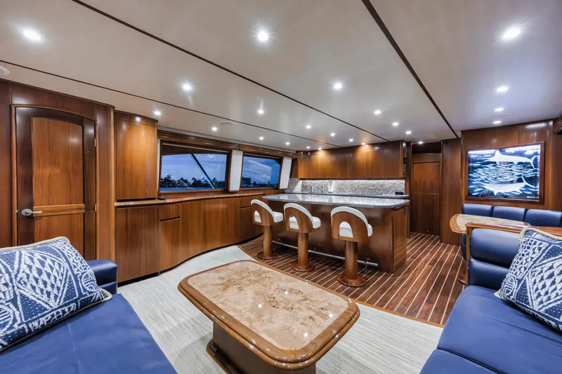 Slide: The Image of Luxurious interior of 2015 Viking 70 Convertible yacht with elegant wood finishes and modern seating. - 32
