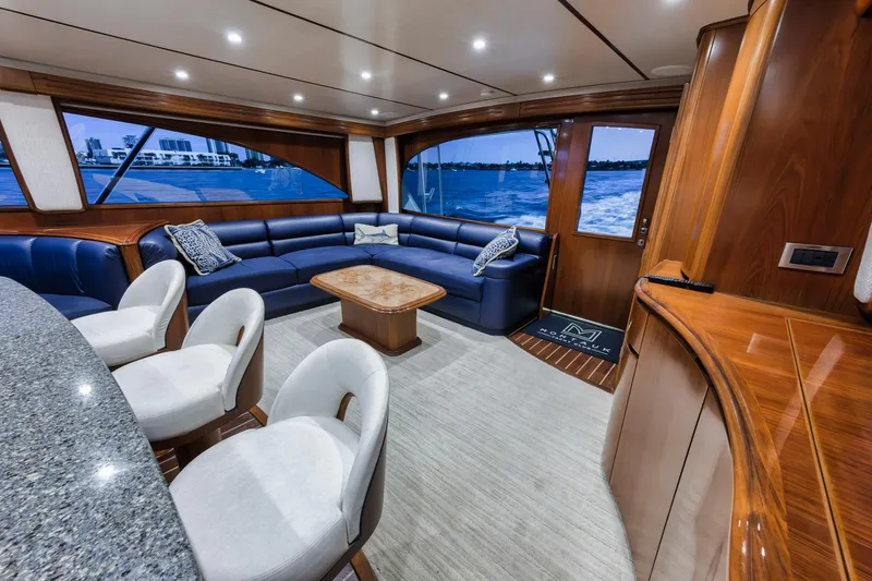 Slide: The Image of Luxurious interior of 2015 Viking 70 Convertible yacht with elegant seating and wooden finishes. - 39