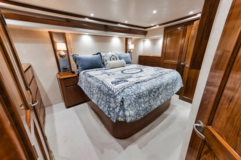 Slide: The Image of Luxurious bedroom interior of 2015 Viking 70 Convertible yacht with elegant wood finishes. - 44