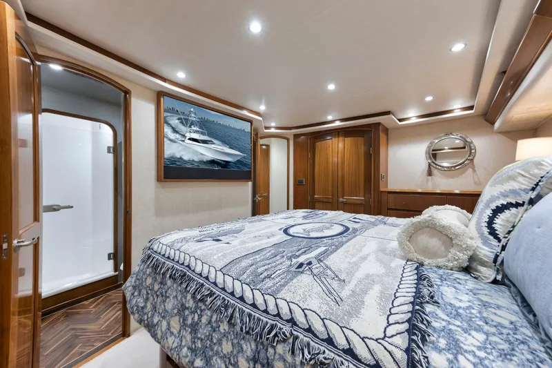 Slide: The Image of Luxurious bedroom interior of 2015 Viking 70 Convertible yacht with elegant decor and wood finishes. - 46