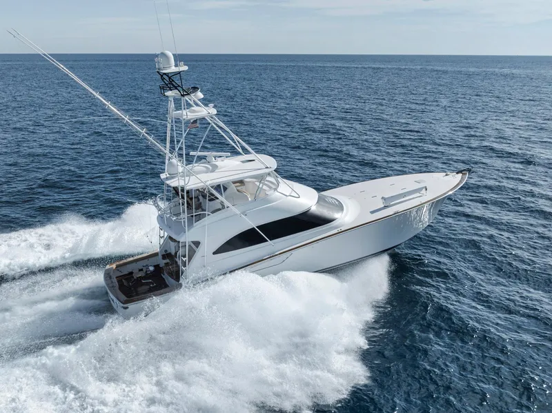 Slide: The Image of 2015 Viking 70 Convertible yacht cruising on open ocean waters. - 5