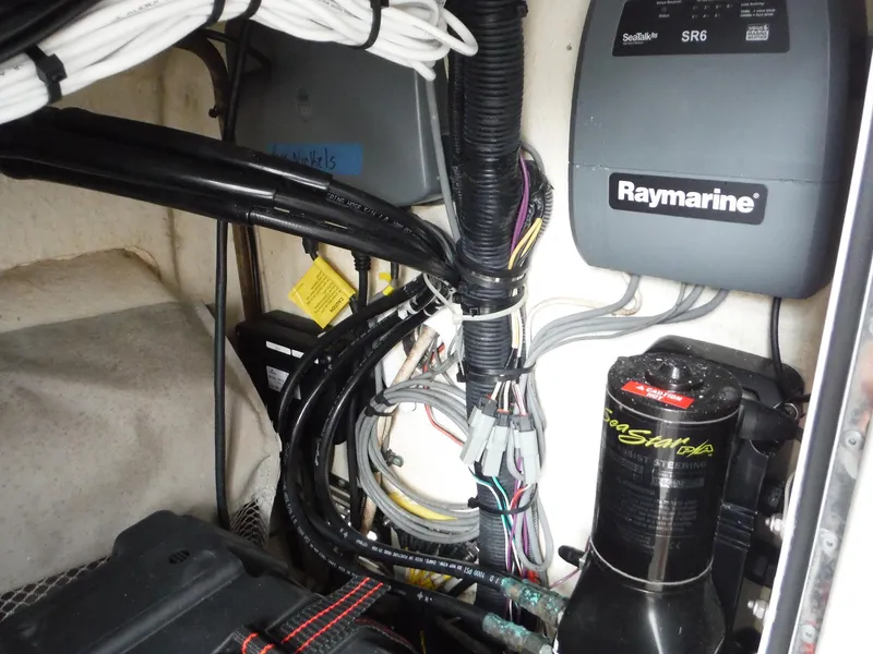Slide: The Image of Electrical components and wiring inside a 2012 Regulator 32 Forward Seating boat. - 28