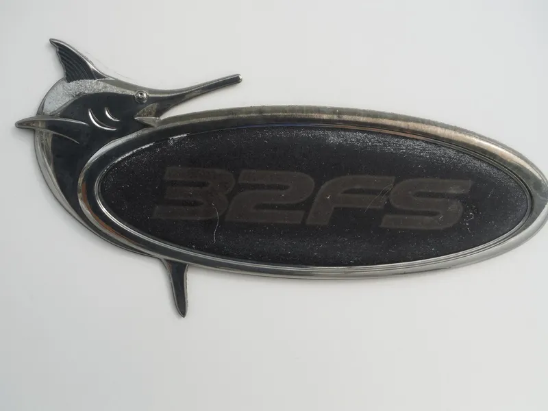 Slide: The Image of 2012 Regulator 32 Forward Seating emblem with marlin design. - 37
