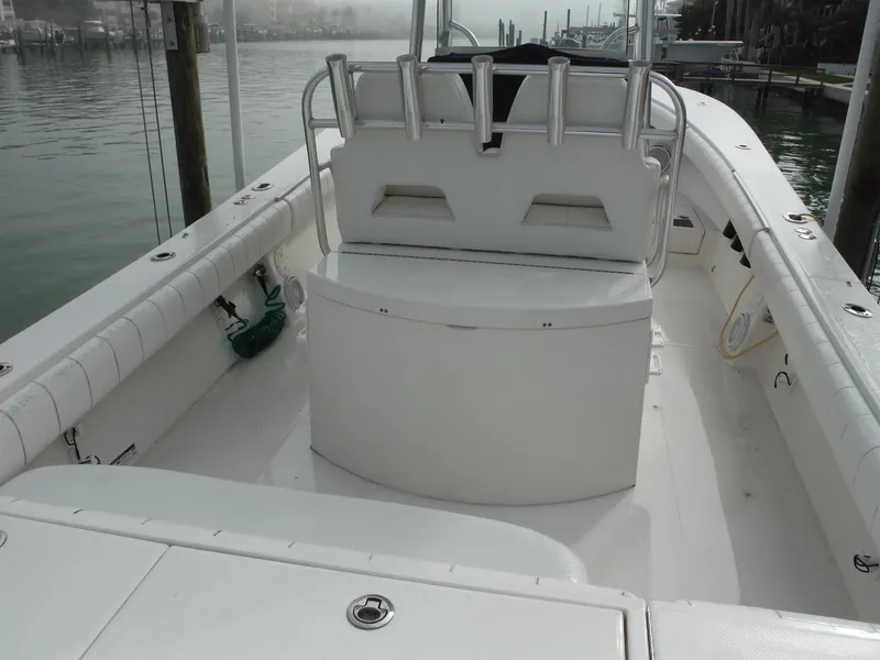 Slide: The Image of 2012 Regulator 32 Forward Seating boat interior, featuring spacious deck and seating area. - 5
