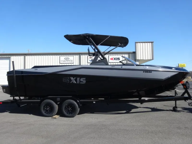The Image of 2025 Axis T250 boat on trailer, black exterior, parked outdoors. - 1