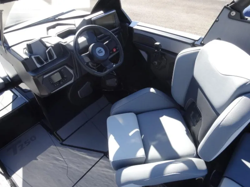 Slide: The Image of Interior of 2025 Axis T250 boat with modern steering and seating. - 10