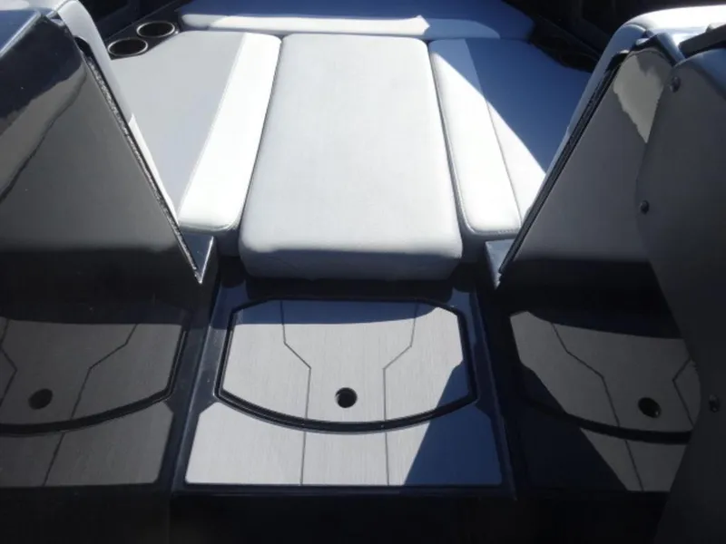 Slide: The Image of 2025 Axis T250 boat interior with sleek seating and cup holders. - 13