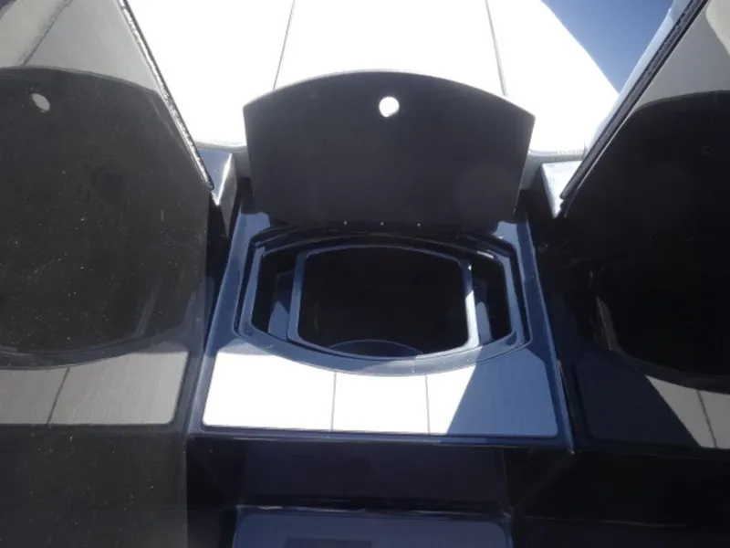 Slide: The Image of 2025 Axis T250 boat storage compartment with open lid, showcasing interior space. - 14