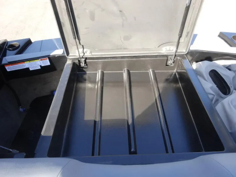 Slide: The Image of Open storage compartment in 2025 Axis T250 boat, showcasing spacious interior design. - 17