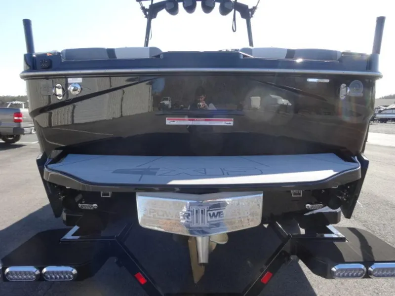 Slide: The Image of Rear view of 2025 Axis T250 boat on trailer, showcasing sleek design and features. - 2