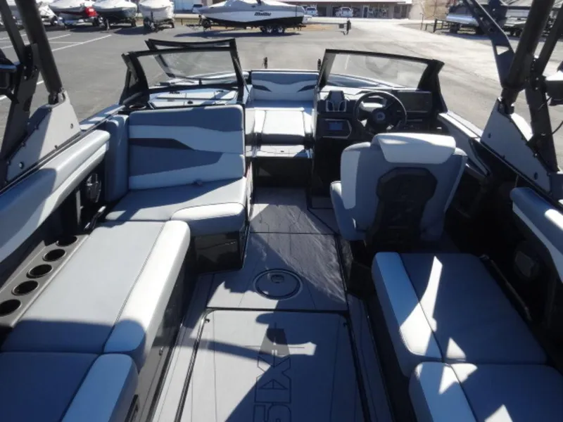 Slide: The Image of Interior of 2025 Axis T250 boat with modern seating and dashboard. - 6