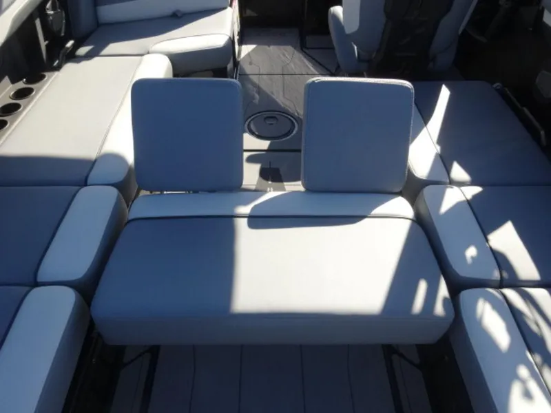 Slide: The Image of 2025 Axis T250 boat interior with gray seating and cup holders. - 8