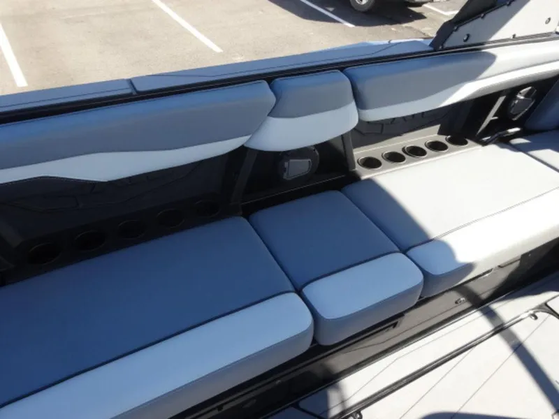 Slide: The Image of 2025 Axis T250 boat interior with gray seating and multiple cup holders. - 9