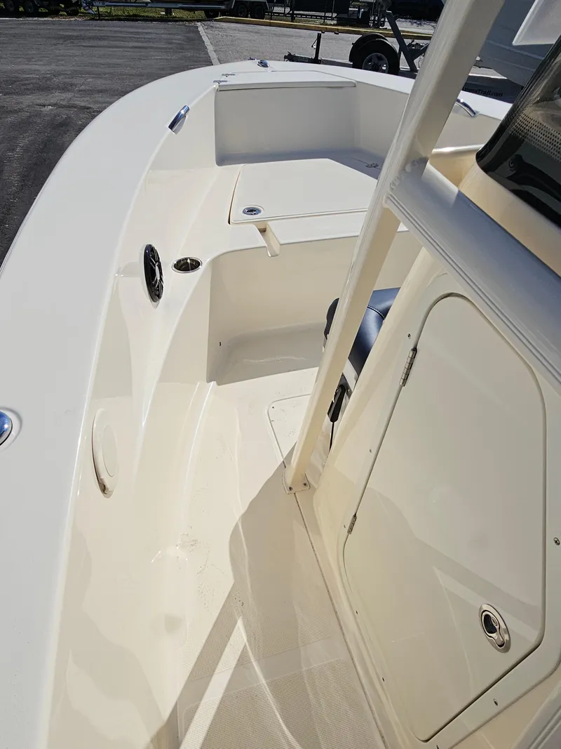 Slide: The Image of 2024 Scout Honda Seabrook 195 CF boat interior, featuring sleek white deck design. - 11