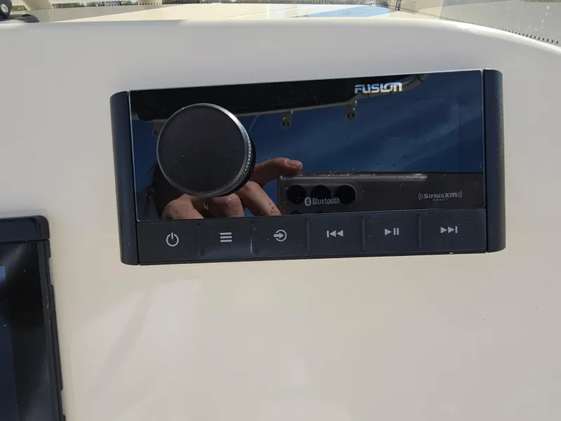 Slide: The Image of Fusion audio system on 2024 Scout Honda Seabrook 195 CF boat dashboard. - 17