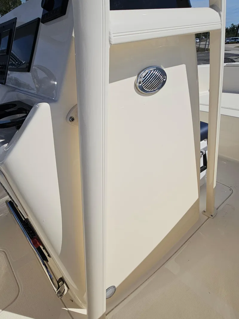 Slide: The Image of 2024 Scout Honda Seabrook 195 CF boat console detail in sunlight. - 21