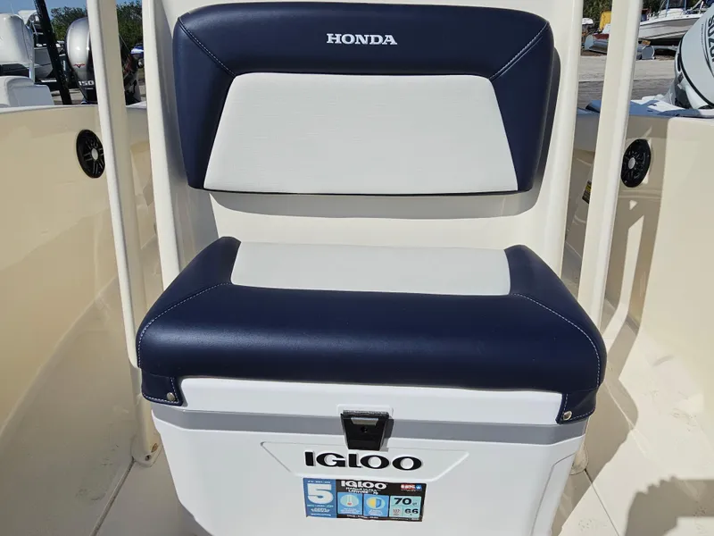 Slide: The Image of 2024 Scout Honda Seabrook 195 CF boat seat with Igloo cooler, navy and white design. - 22