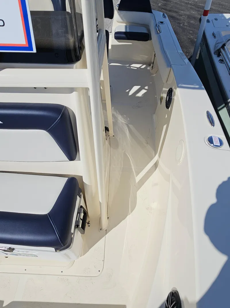 Slide: The Image of 2024 Scout Honda Seabrook 195 CF boat interior with seating and deck view. - 26