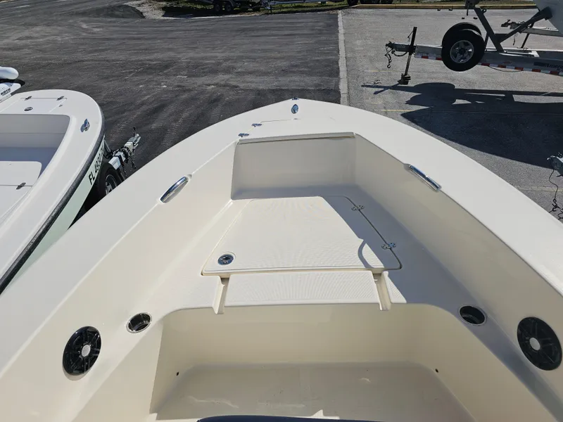 Slide: The Image of 2024 Scout Honda Seabrook 195 CF boat interior, featuring spacious deck and storage compartments. - 28