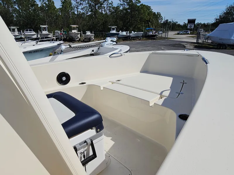 Slide: The Image of 2024 Scout Honda Seabrook 195 CF boat interior with seating and storage. - 3