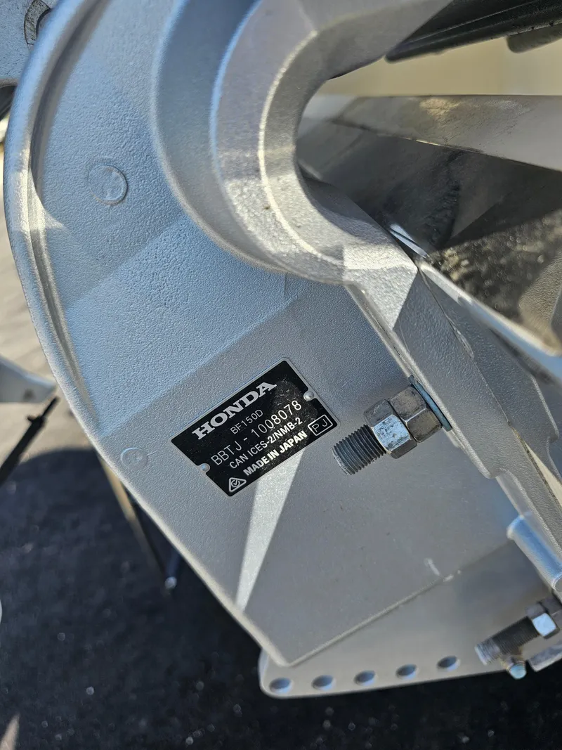 Slide: The Image of Close-up of a 2024 Honda Seabrook 195 CF engine part with label. - 30