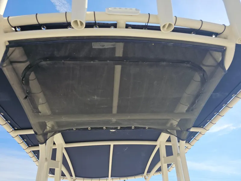 Slide: The Image of 2024 Scout Honda Seabrook 195 CF boat canopy under blue sky. - 31