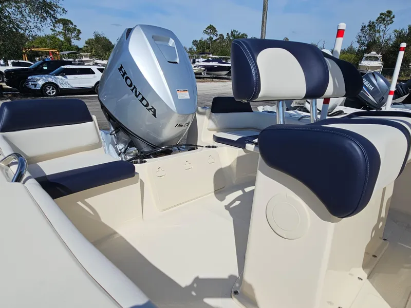 Slide: The Image of 2024 Scout Honda Seabrook 195 CF boat interior with Honda 150 engine. - 4