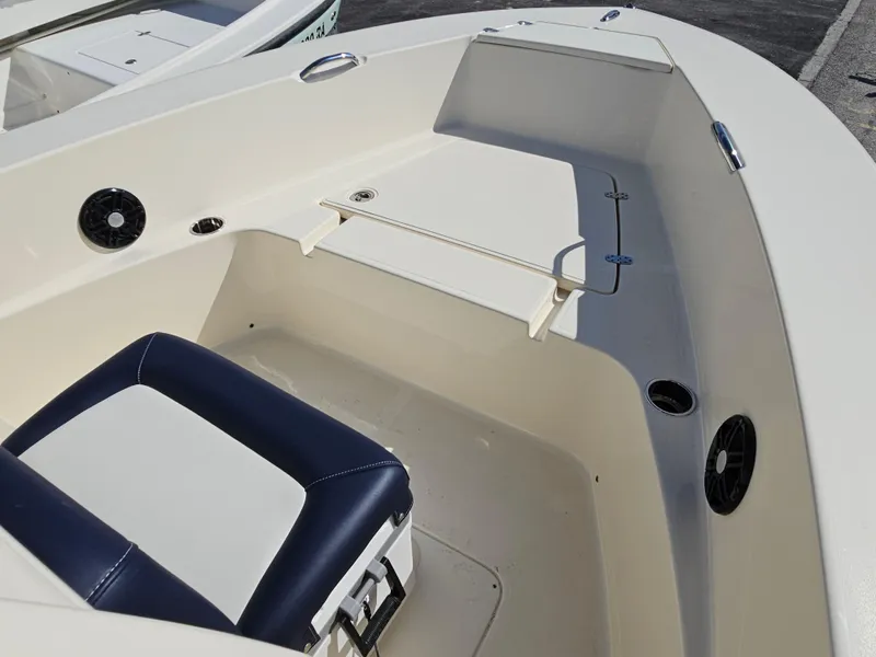 Slide: The Image of 2024 Scout Honda Seabrook 195 CF boat interior with seating and storage. - 9