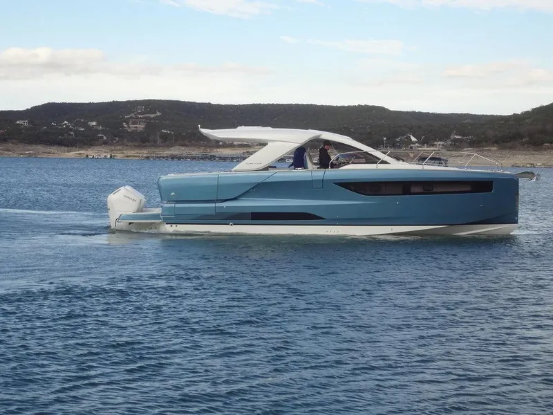 Slide: The Image of 2025 Jeanneau DB/43 OB yacht cruising on calm waters. - 12