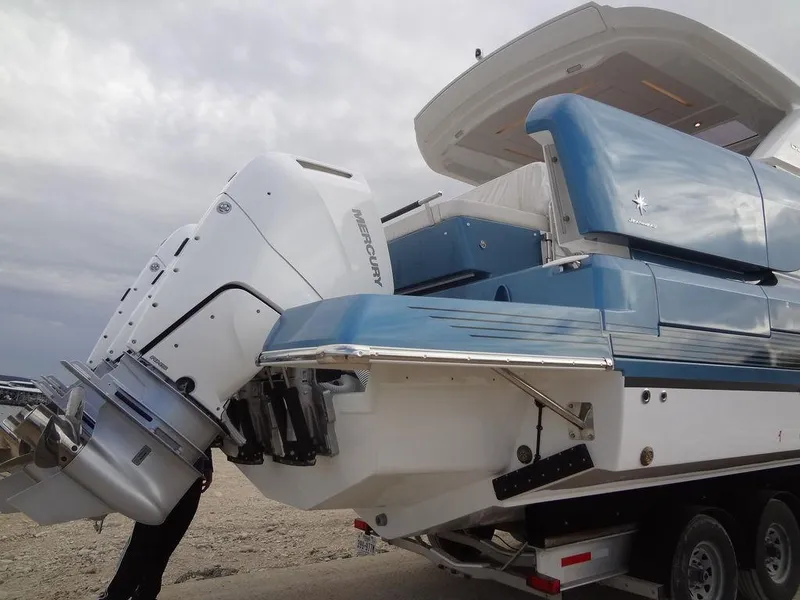 Slide: The Image of 2025 Jeanneau DB/43 OB boat with Mercury outboard engines on a trailer. - 21