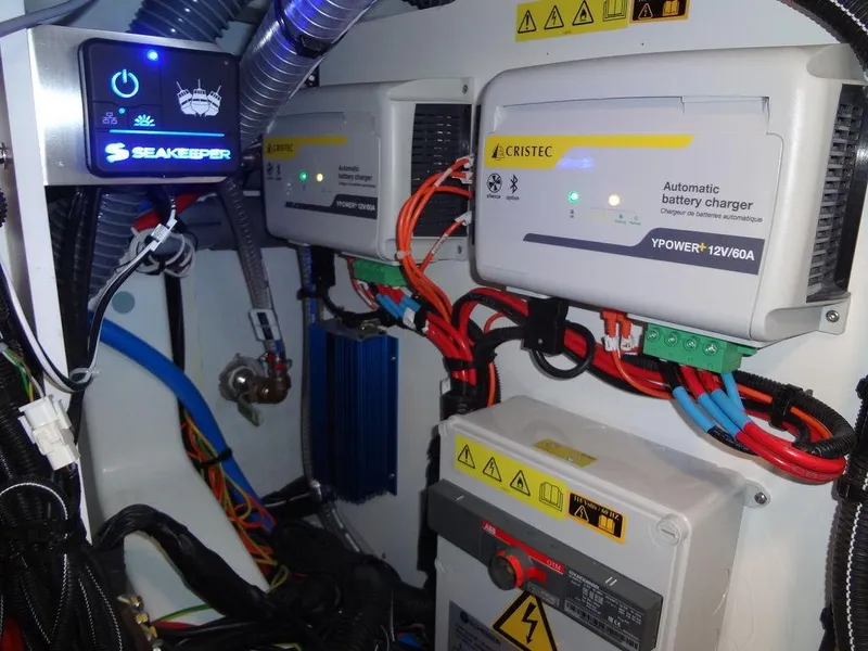 Slide: The Image of Electrical system of 2025 Jeanneau DB/43 OB with battery chargers and wiring. - 46