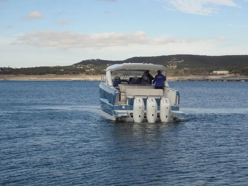 Slide: The Image of 2025 Jeanneau DB/43 OB boat cruising on calm waters. - 8
