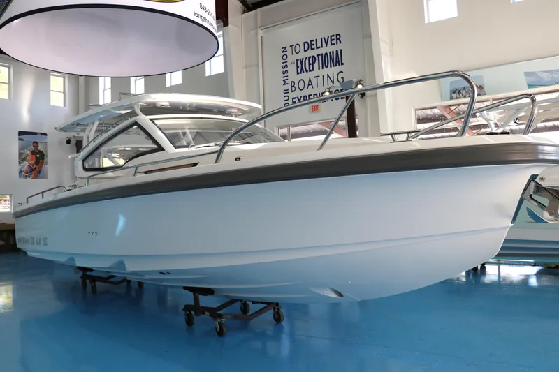The Image of 2025 Nimbus Weekender 9 boat displayed indoors on a blue floor. - 0